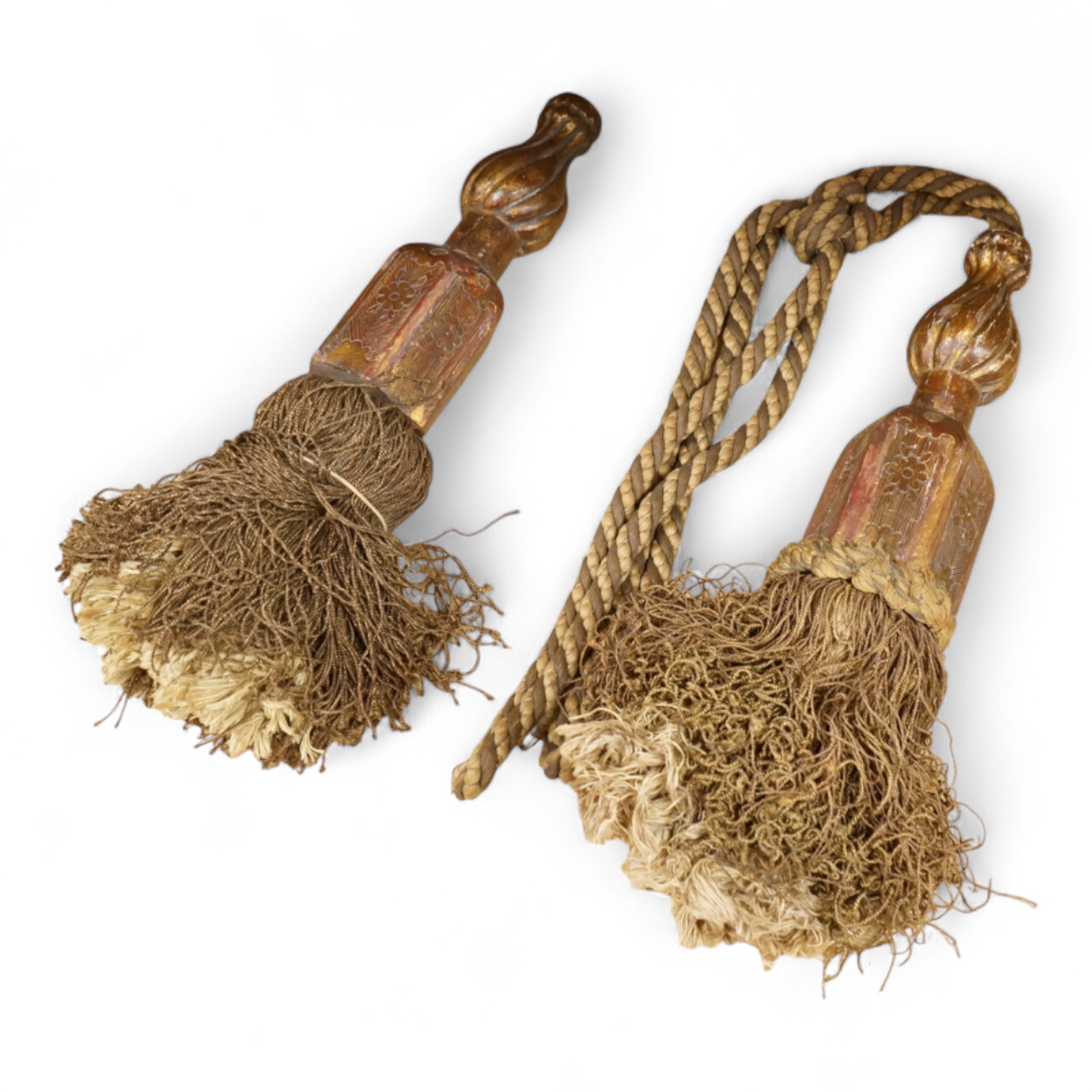 A pair of 19th century Venetian carved wood and tasseled tie-backs